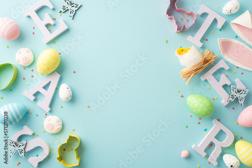 Canvas Print Top view photo of letters word easter colorful eggs bunny ears paws baking molds
