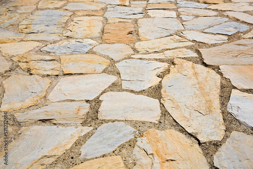 Old italian paving built with irregularly shaped stone blocks called opus incertum