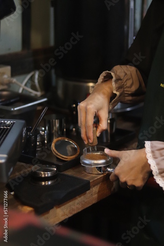 barista making a cup of coffee
