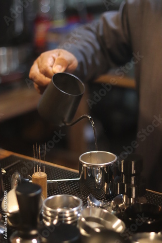 barista making a cup of coffee