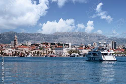 Travel by Croatia. Beautiful landscape with Split Old Town on sea promenade. Yacht in the harbour.