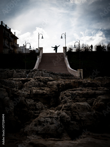 domenico modugno statue in polignano a mare, silhouette