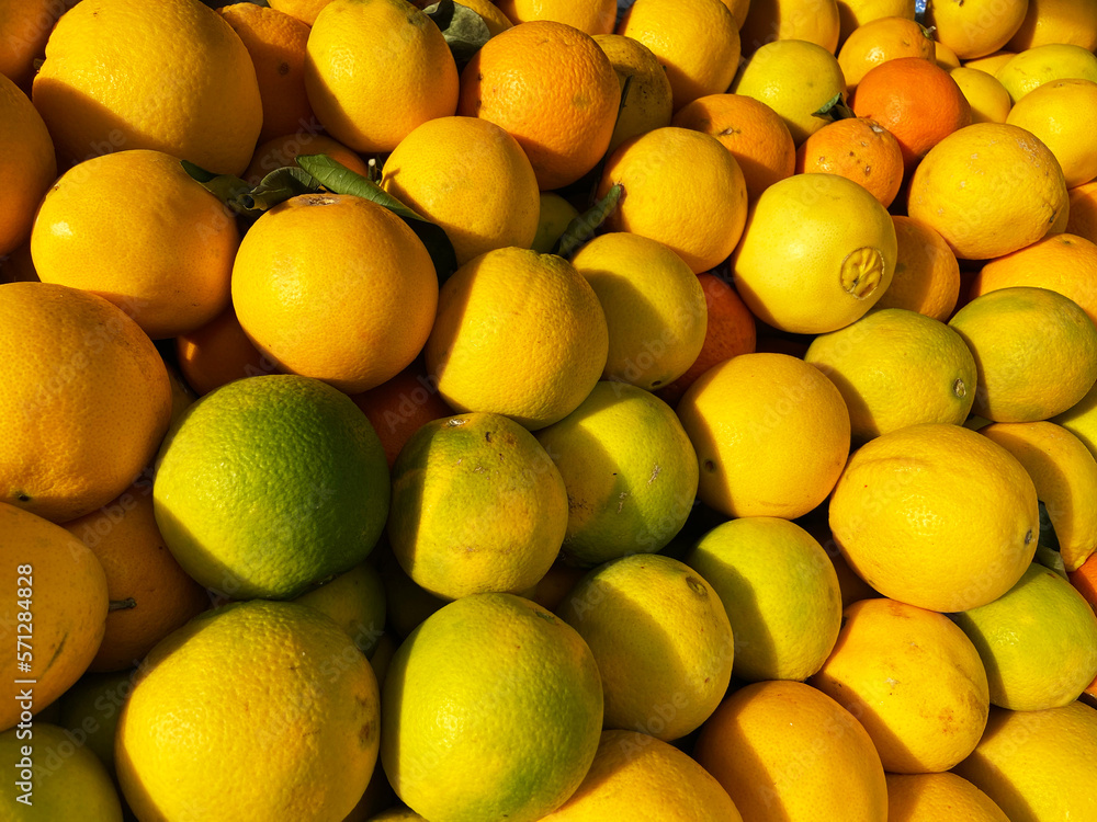 Many fresh tasty oranges background. Vitamins natural nutrition concept. fruit showcase