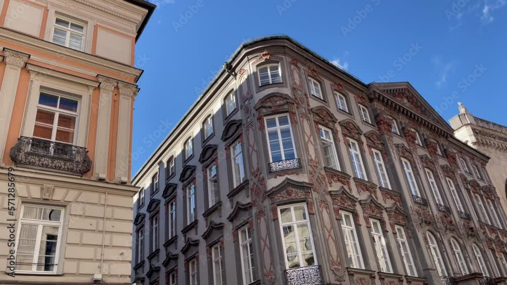 Classic building facades under blue sky in Munich, Germany. Traditional Bavarian architecture style concept Classic building facades under blue sky in Munich, Germany. Traditional Bavarian architecture style concept