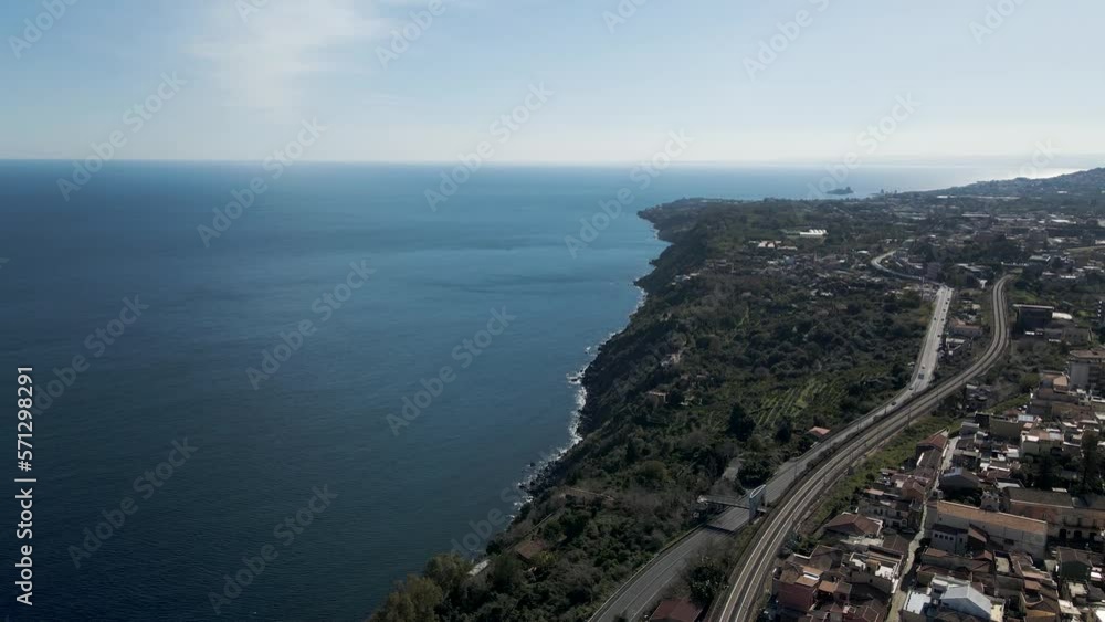 Aerial view of a road along the coastline in Acireale, Catania province, Sicily, Italy. Aerial view of a road along the coastline in Acireale, Catania province, Sicily, Italy.