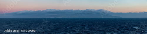 Fototapeta Naklejka Na Ścianę i Meble -  Island on Mediterranean Sea. Tinos, near Mikonos, Greece, Europe. Nature Background Panorama. Sunrise Sky