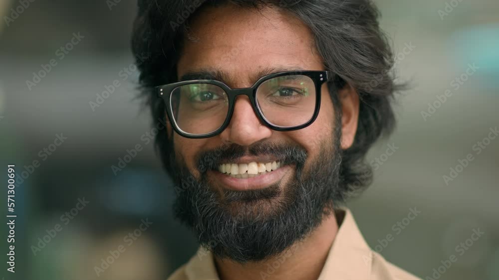 Close up portrait happy Indian bearded 30s businessman in eyeglasses male posing for camera. Handsome Arabian multiethnic man in glasses business executive smiling with toothy smile. Cheerful employer Close up portrait happy Indian bearded 30s businessman in eyeglasses male posing for camera. Handsome Arabian multiethnic man in glasses business executive smiling with toothy smile. Cheerful employer