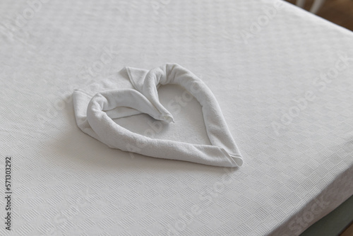 Wallpaper Mural Towel laid out in the shape of heart. Hotel service. Honeymoon. Natural. Soft focus Torontodigital.ca