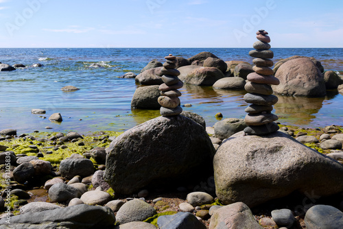 a pile of stones on a sea sand beach