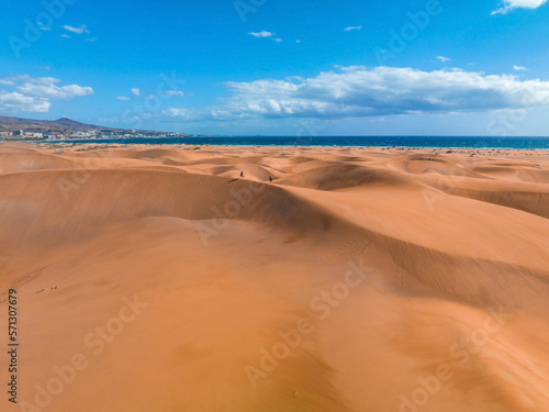 Panoramic aerial scene of the Maspalomas Dunes in Playa del Ingles, Maspalomas, Gran Canaria, Spain. Endless desert sands. Magical safari dunes.