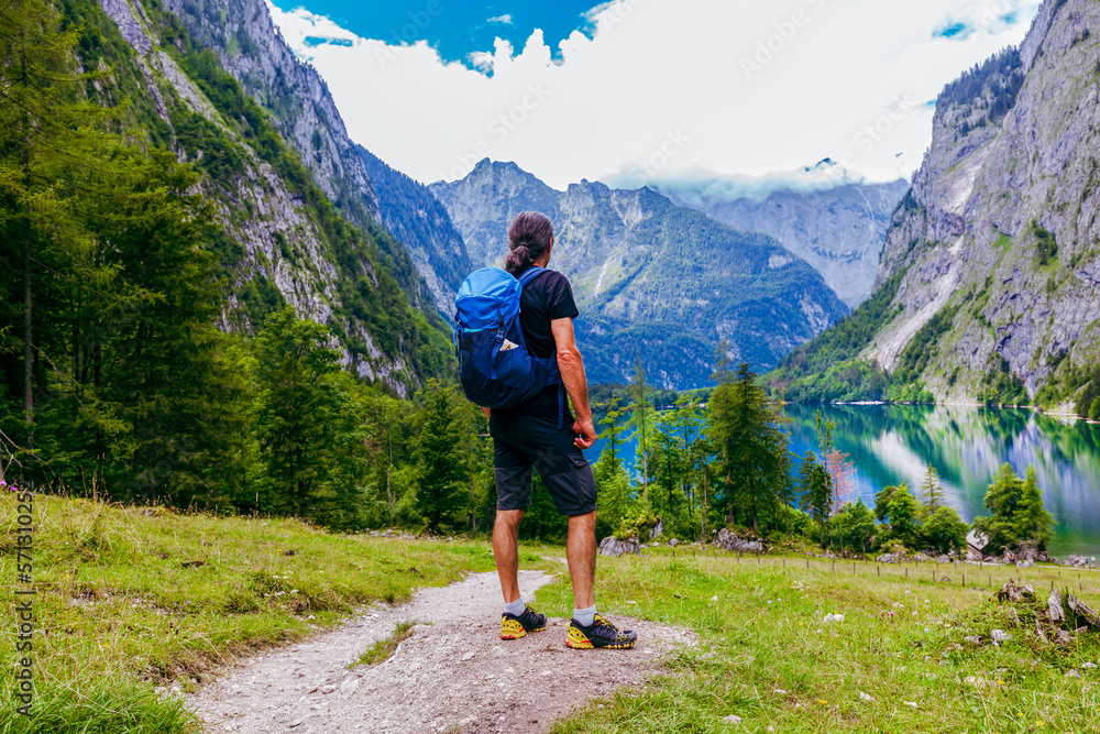 Man is hiking at Obersee am Königssee. beautiful Bavarian Landscape Behind and between the Königsee and Obersee