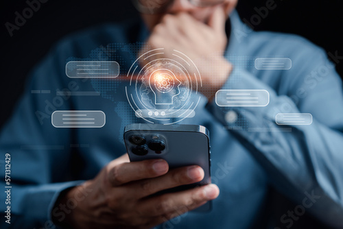 Businessman using chat bot in smartphone intelligence Ai.Chat bot with AI Artificial Intelligence, developed by OpenAI generate. Futuristic technology, robot in online system. photo