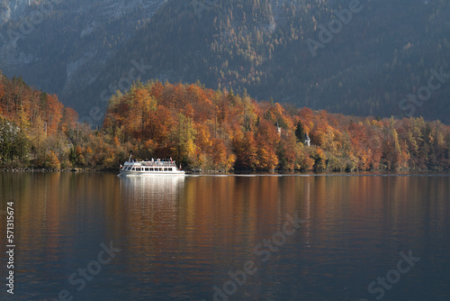 hallsttat mountain village surrounded by lakes and trees in autumn