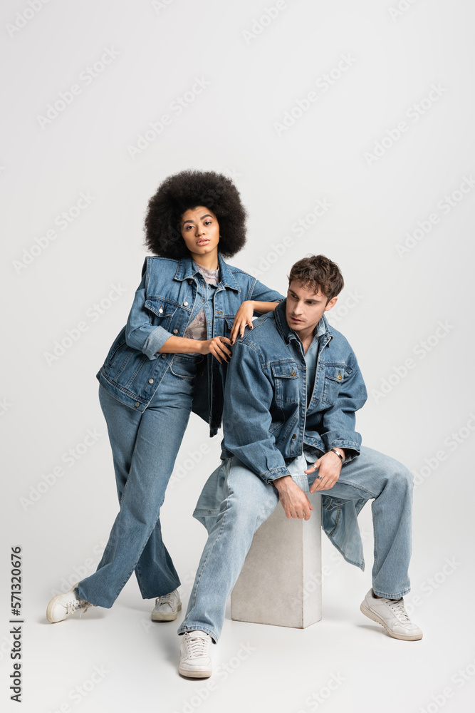 full length of brunette african american woman in sneakers standing ...