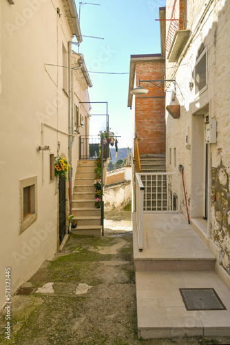Fototapeta Naklejka Na Ścianę i Meble -  A narrow street between the old houses of Bovino, an ancient town in Puglia, Italy.