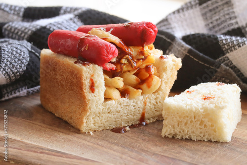 Traditional South African fast food called a Kota. Quarter loaf of bread usually filled with chips and Vienna's