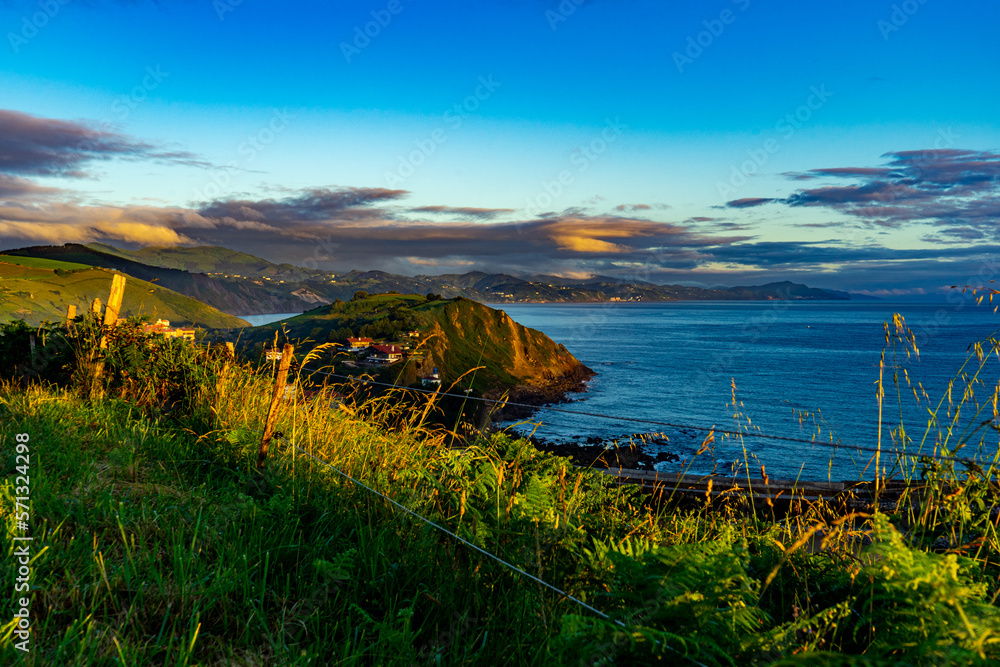 Obraz premium Landscape overlooking the green hills and the Atlantic Ocean. Coast of Basque Country, Spain