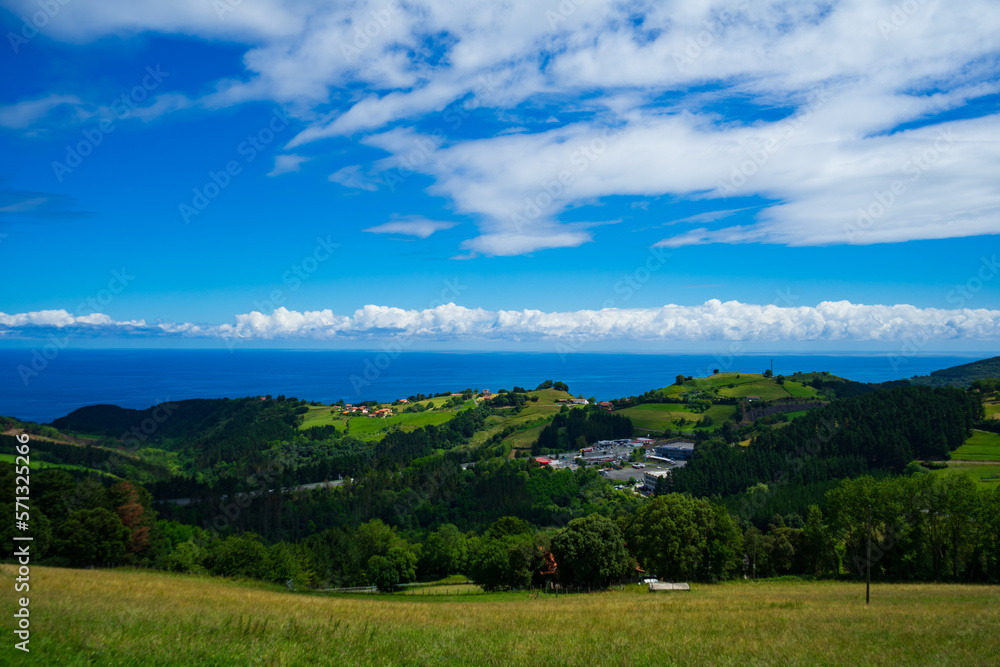 Landscape overlooking the green hills and the Atlantic Ocean. Coast of Basque Country, Spain