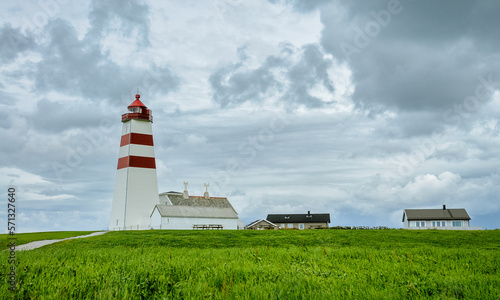 lighthouse on the coast with clouds