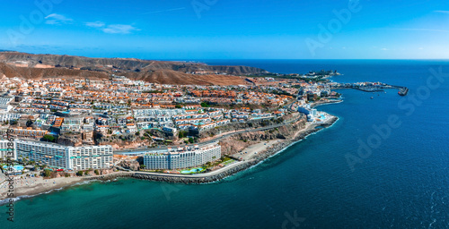 Beautiful aerial landscape with Anfi beach and resort, Gran Canaria, Spain. Luxury hotels, turquoise water, sandy beaches in Spain. Luxury beach vacation concept. Heart shaped island. © ingusk