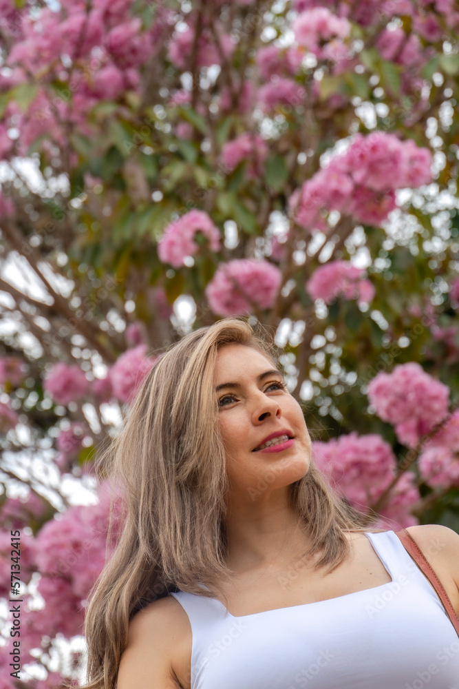 beautiful blonde woman traveling through towns and making stops on the road enjoying the trip walking through old streets beautiful blonde woman traveling through towns and making stops on the road enjoying the trip walking through old streets