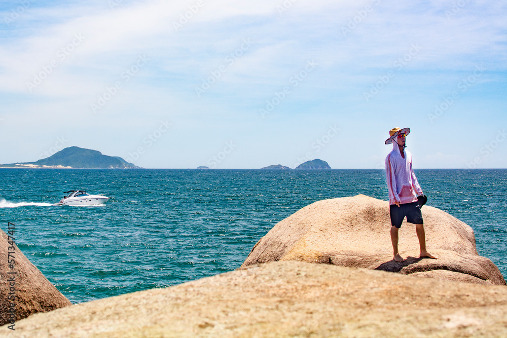 Florianopolis , Brazil - JANUARY 21, 2023 : Tourists enjoy the summer in natural pools in Barra da Lagoa. Florianopolis , Brazil - JANUARY 21, 2023 : Tourists enjoy the summer in natural pools in Barra da Lagoa.
