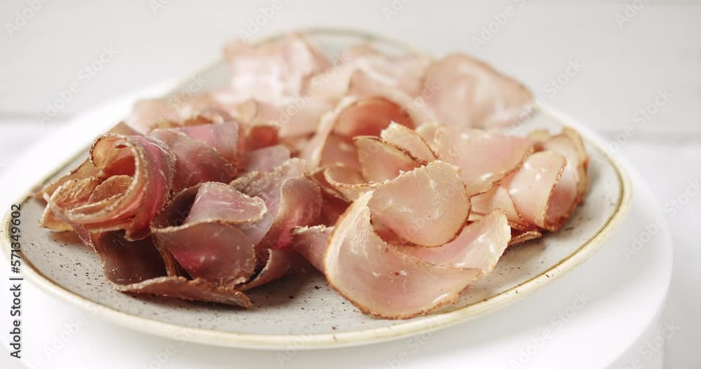 Plate with Smoked meat snacks for beer. plate minced meat, and snacks. bbq meat set for beer snack on rotating plate and white background, Banner and message for text. Restaurant service and food . Plate with Smoked meat snacks for beer. plate minced meat, and snacks. bbq meat set for beer snack on rotating plate and white background, Banner and message for text. Restaurant service and food .