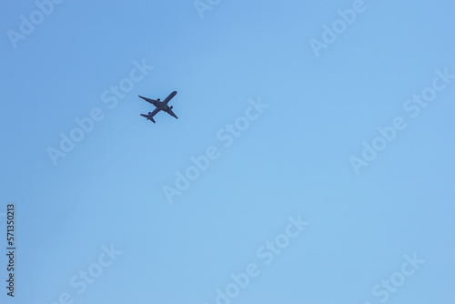 Low Angle View Of Silhouette Airplane Against Clear Blue Sky