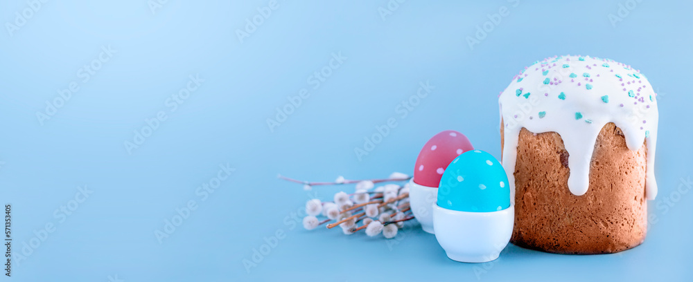 Easter egg and cake on blue background. Spring holiday Easter egg and cake on blue background. Spring holiday