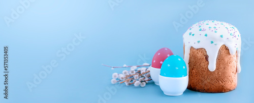 Easter egg and cake on blue  background. Spring holiday photo