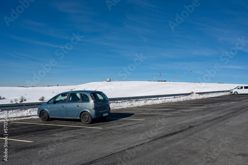 Parking for 2 cars on the Wasserkuppe with a view of the dome in winter with lots of snow