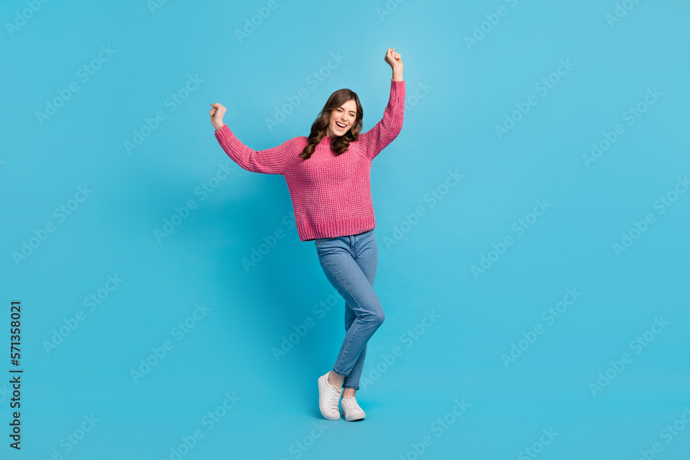 Full length size photo of relax carefree lady wear pink sweater vibe music chill out have fun enjoy rhythm weekend isolated on blue color background Full length size photo of relax carefree lady wear pink sweater vibe music chill out have fun enjoy rhythm weekend isolated on blue color background