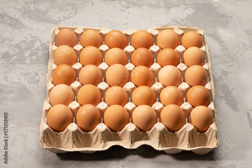 Chicken eggs in egg carton on gunny sack. High quality photo