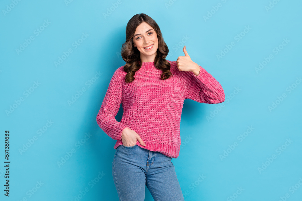 Photo of cheerful lovely lady wear trendy clothes hand thumb up advise new boutique quality product isolated on blue color background Photo of cheerful lovely lady wear trendy clothes hand thumb up advise new boutique quality product isolated on blue color background