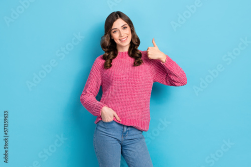 Photo of cheerful lovely lady wear trendy clothes hand thumb up advise new boutique quality product isolated on blue color background