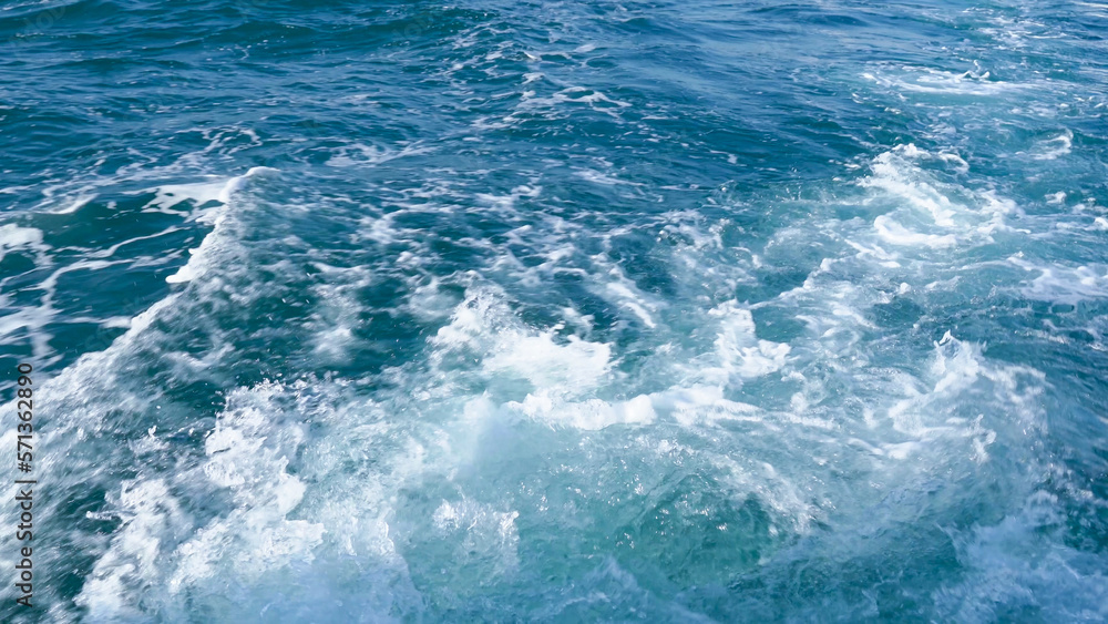 Splash sea wave from cruise ship. Ocean wake and foam