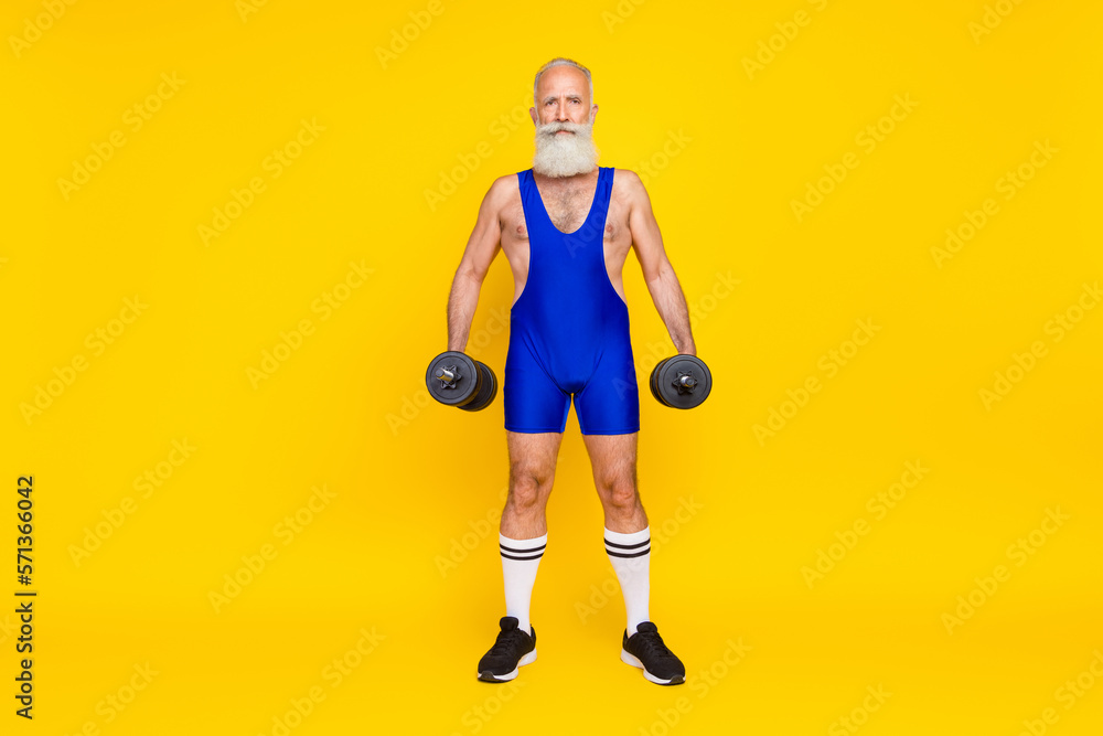 Full length photo of brutal strong senior sporty coach wear retro costume training intense regime isolated on yellow color background Full length photo of brutal strong senior sporty coach wear retro costume training intense regime isolated on yellow color background