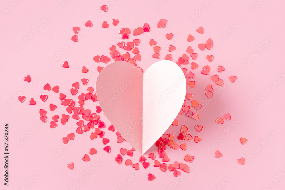 Red heart confetti papet pink heart on pink background, valentines day concept celebration