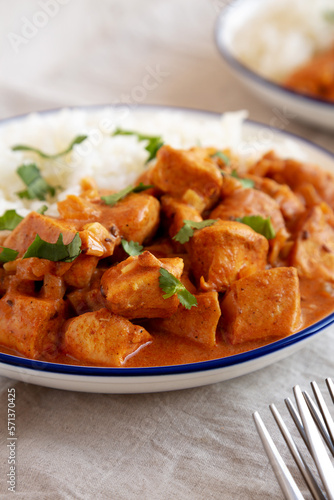 Homemade Easy Indian Butter Chicken with Rice on a Plate, low angle view.