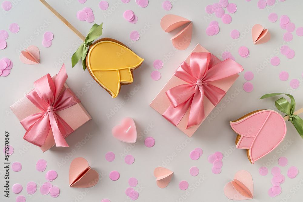 Biscuit dessert flowers with confetti on grey background Biscuit dessert flowers with confetti on grey background