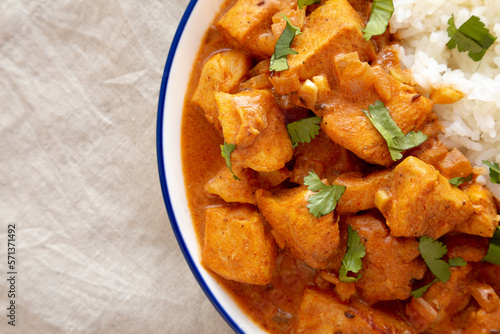 Homemade Easy Indian Butter Chicken with Rice on a Plate, top view. Flat lay, overhead, from above. Copy space.