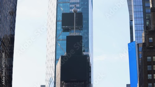Footage of the New Years Eve Ball Dropping at One Times Square on the skyscraper on Times Square in the Midtown Manhattan neighbourhood of New York City in the winter time just before new years eve.