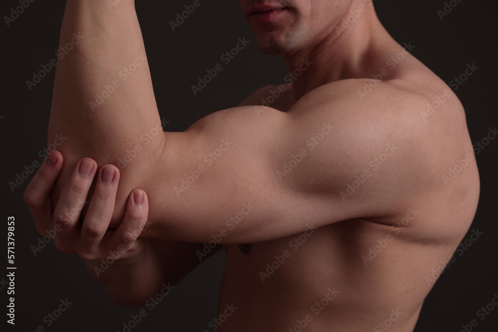 Sport man biceps, shoulder, arm close up. Weight lifting concept