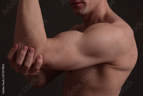 Sport man biceps, shoulder, arm close up. Weight lifting concept