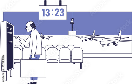 A man looks at the schedule of planes in the waiting room at the airport.