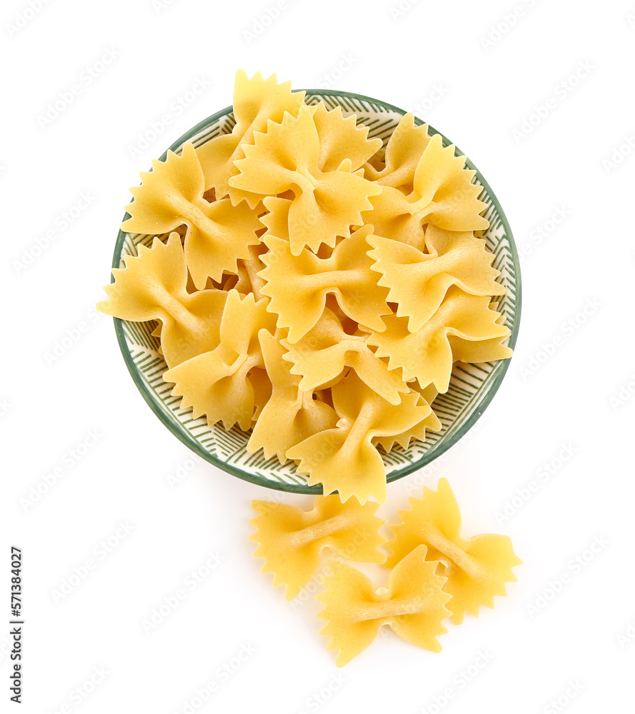 Bowl of raw farfalle pasta isolated on white background Bowl of raw farfalle pasta isolated on white background