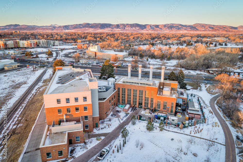 sunrise over Fort Collins, Colorado with Rocky Mountains in background, aerial view