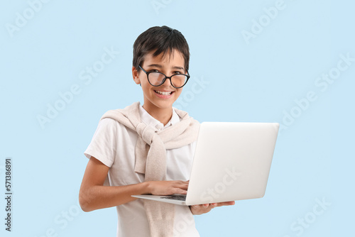Little boy in eyeglasses us...