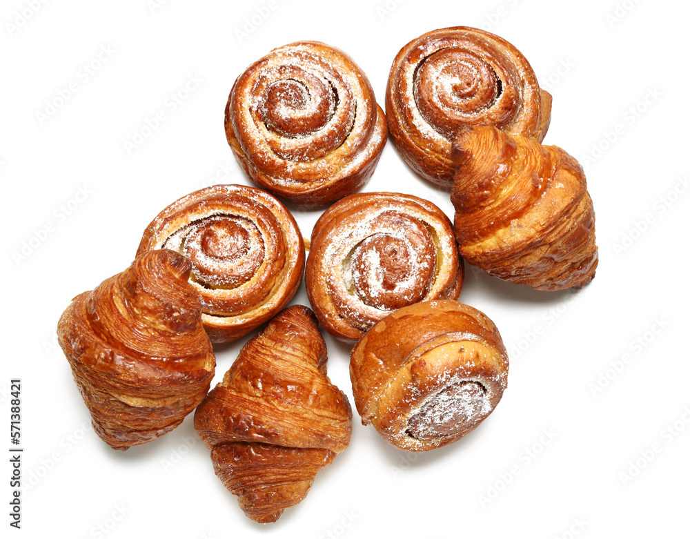 Fototapeta premium Delicious croissants and cinnamon rolls isolated on white background