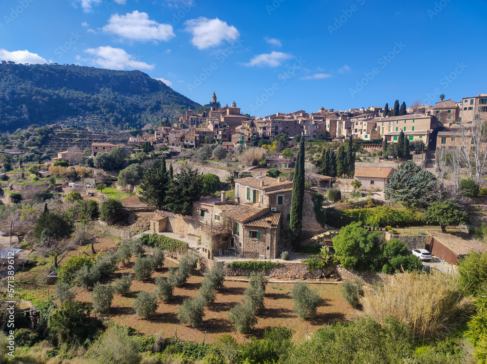 Valldemosa town in the island of Majorca. Beautiful scene of an old village surround by mountain with old stone houses and trees